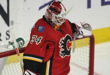 CALGARY, AB - APRIL 27: Miikka Kiprusoff of the Calgary Flames stands in his net near the end of the Flames series ending 4 - 1 loss to the Chicago Blackhawks in Game Six of the Western Conference Quarterfinals of the 2009 Stanley Cup Playoffs on April 27, 2009 at the Pengrowth Saddledome in Calgary, Alberta, Canada. (Photo by Mike Ridewood/Getty Images)