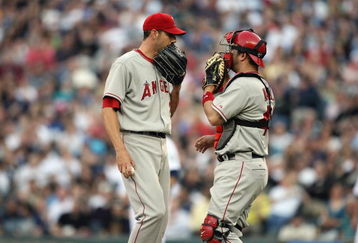 SEATTLE - APRIL 12:  Catcher Mike Napoli #44 meets with Jon Garland #20 of the Los Angeles Angels of Anaheim during the game against the Seattle Mariners on April 12, 2008 at Safeco Field in Seattle, Washington. (Photo by Otto Greule Jr/Getty Images)
