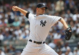 NEW YORK - JUNE 14: A.J. Burnett #34 of the New York Yankees pitches against the New York Mets on June 14, 2009 at Yankee Stadium in the Bronx borough of New York City.  (Photo by Nick Laham/Getty Images)