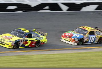 DAYTONA BEACH, FL - FEBRUARY 12:  Mark Martin, driver of the #5 Kellogg's/CARQUEST Chevrolet, races Kyle Busch, driver of the #18 M&M's Toyota, during the NASCAR Sprint Cup Series Gatorade Duel 2 at Daytona International Speedway on February 12, 2009 in Daytona Beach, Florida.  (Photo by Geoff Burke/Getty Images for NASCAR)