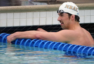 SANTA CLARA, CA - JUNE 14:  Michael Phelps looks on after a preliminary heat of the 100m reestyle during the XLII Santa Clara  International Invitational Swim Meet on June 14, 2009 at the Santa Clara Swim Club in Santa Clara, California.  (Photo by Jed Jacobsohn/Getty Images)