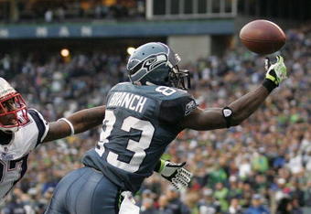 SEATTLE - DECEMBER 07:  Wide receiver Deion Branch #83 of the Seattle Seahawks makes a touchdown catch against Ellis Hobbs #27 of the New England Patriots on December 7, 2008 at Qwest Field in Seattle, Washington. The Patriots defeated the Seahawks 24-21. (Photo by Otto Greule Jr/Getty Images)