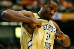 ATLANTA - MARCH 12:  Gani Lawal #31 of the Georgia Tech Yellow Jackets reacts after dunking against the Clemson Tigers during day one of the 2009 ACC Men's Basketball Tournament on March 12, 2009 at the Georgia Dome in Atlanta, Georgia.  (Photo by Kevin C. Cox/Getty Images)