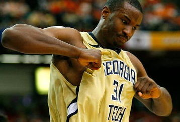 ATLANTA - MARCH 12:  Gani Lawal #31 of the Georgia Tech Yellow Jackets reacts after dunking against the Clemson Tigers during day one of the 2009 ACC Men's Basketball Tournament on March 12, 2009 at the Georgia Dome in Atlanta, Georgia.  (Photo by Kevin C. Cox/Getty Images)