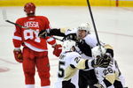 DETROIT - JUNE 12:  Maxime Talbot #25 of the Pittsburgh Penguins celebrates his first goal in the second period with teammates Evgeni Malkin #71 and Ruslan Fedotenko #26 as Marian Hossa #81 of the Detroit Red Wings skates by during Game Seven of the 2009 NHL Stanley Cup Finals at Joe Louis Arena on June 12, 2009 in Detroit, Michigan.  (Photo by Jamie Sabau/Getty Images)
