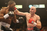 LAS VEGAS - FEBRUARY 16:  Kelly Pavlik connects with a right against Jermain Taylor during their middlleweight fight at the MGM Grand Garden Arena on February 16, 2008 in Las Vegas, Nevada.  (Photo by Jed Jacobsohn/Getty Images)