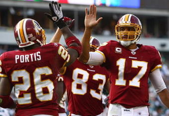 PHILADELPHIA - OCTOBER 05:  Jason Campbell #17 of the Washington Redskins congratulates teammate Clinton Portis #26 after his touchdown against the Philadelphia Eagles on October 5, 2008 at Lincoln Financial Field in Philadelphia, Pennsylvania.  (Photo by Chris McGrath/Getty Images)