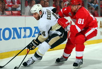 DETROIT - JUNE 12: Rob Scuderi #4 of the Pittsburgh Penguins defends against Marian Hossa #81 of the Detroit Red Wings during Game Seven of the 2009 NHL Stanley Cup Finals at Joe Louis Arena on June 12, 2009 in Detroit, Michigan.  (Photo by Jim McIsaac/Getty Images)