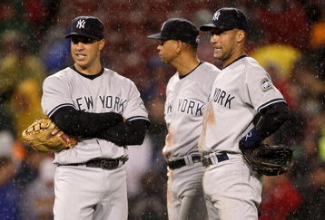 BOSTON - JUNE 11: Mark Teixeira #25, Alex Rodriguez #13, and Derek Jeter #2 of the New York Yankees stand in the rain during a pitching change against the Boston Red Sox at Fenway Park on June 11, 2009 in Boston, Massachusetts.  (Photo by Jim Rogash/Getty Images)