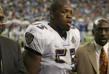 DETROIT - OCTOBER 9:  Terrell Suggs #55 of the Baltimore Ravens is escorted off the field after a personal foul and ejection for an intimidating action towards an official in the second half against the Detroit Lions at Ford Field October 9, 2005 in Detroit, Michigan. The Lions won, 35-17.  (Photo by Tom Pidgeon/Getty Images)