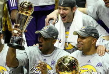 ORLANDO, FL - JUNE 14:  The Los Angeles Lakers celebrate after defeating the Orlando Magic 99-86 in Game Five of the 2009 NBA Finals on June 14, 2009 at Amway Arena in Orlando, Florida.  NOTE TO USER:  User expressly acknowledges and agrees that, by downloading and or using this photograph, User is consenting to the terms and conditions of the Getty Images License Agreement.  (Photo by Elsa/Getty Images)