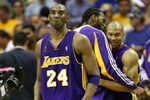 ORLANDO, FL - JUNE 14:  Kobe Bryant #24, Josh Powell #21 and Derek Fisher #2 of the Los Angeles Lakers begin celebrating in the fourth quarter before defeating the Orlando Magic 99-86 in Game Five of the 2009 NBA Finals on June 14, 2009 at Amway Arena in Orlando, Florida.  NOTE TO USER:  User expressly acknowledges and agrees that, by downloading and or using this photograph, User is consenting to the terms and conditions of the Getty Images License Agreement.  (Photo by Elsa/Getty Images)