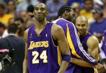 ORLANDO, FL - JUNE 14:  Kobe Bryant #24, Josh Powell #21 and Derek Fisher #2 of the Los Angeles Lakers begin celebrating in the fourth quarter before defeating the Orlando Magic 99-86 in Game Five of the 2009 NBA Finals on June 14, 2009 at Amway Arena in Orlando, Florida.  NOTE TO USER:  User expressly acknowledges and agrees that, by downloading and or using this photograph, User is consenting to the terms and conditions of the Getty Images License Agreement.  (Photo by Elsa/Getty Images)