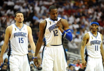 ORLANDO, FL - JUNE 14:  (L-R) Hedo Turkoglu #15, Dwight Howard #12 and Courtney Lee #11 of the Orlando Magic walk across the court in the final moments of the Magic loss to the Los Angeles Lakers in Game Five of the 2009 NBA Finals on June 14, 2009 at Amway Arena in Orlando, Florida.  NOTE TO USER:  User expressly acknowledges and agrees that, by downloading and or using this photograph, User is consenting to the terms and conditions of the Getty Images License Agreement.  (Photo by Ronald Martinez/Getty Images)