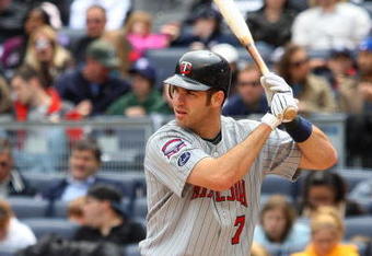 NEW YORK - MAY 17:  Joe Mauer #7 of the Minnesota Twins bats against the New York Yankees on May 17, 2009 at Yankee Stadium in the Bronx borough of New York City. The Yankees defeated the Twins 3-2 in ten innings.  (Photo by Jim McIsaac/Getty Images)