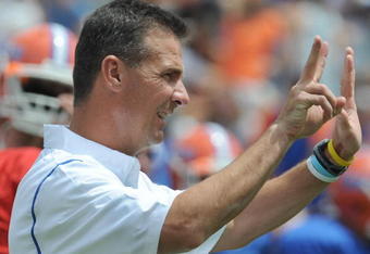 GAINESVILLE, FL - APRIL 18: Coach Urban Meyer of the University of Florida directs the spring football Orange and Blue game April 18, 2009 at Ben Hill Griffin Stadium in Gainesville, Florida.  (Photo by Al Messerschmidt/Getty Images)