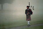 28 Oct 1999: A bag pipper walks in the morning fog at Payne Stewart's Memorial before The Tour Championship at the Champions Golf Club in Houston, Texas.