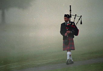 28 Oct 1999: A bag pipper walks in the morning fog at Payne Stewart's Memorial before The Tour Championship at the Champions Golf Club in Houston, Texas.