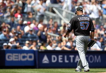 NEW YORK - JUNE 14:  Johan Santana #57 of the New York Mets leaves the game in the fourth inning against the New York Yankees on June 14, 2009 at Yankee Stadium in the Bronx borough of New York City.  (Photo by Nick Laham/Getty Images)