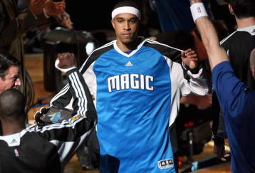 ORLANDO, FL - JUNE 9:  Courtney Lee #11 of the Orlando Magic is introduced before Game Three of the 2009 NBA Finals against the Los Angeles Lakers on June 9, 2009 at Amway Arena in Orlando, Florida.  The Magic won 108-104.  NOTE TO USER:  User expressly acknowledges and agrees that, by downloading and or using this photograph, User is consenting to the terms and conditions of the Getty Images License Agreement. (Photo by Elsa/Getty Images)