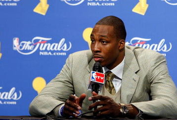 ORLANDO, FL - JUNE 14:  Dwight Howard #12 of the Orlando Magic looks on during the post game news conference after losing to the Los Angeles Lakers 99-86 in Game Five of the 2009 NBA Finals on June 14, 2009 at Amway Arena in Orlando, Florida.  NOTE TO USER:  User expressly acknowledges and agrees that, by downloading and or using this photograph, User is consenting to the terms and conditions of the Getty Images License Agreement.  (Photo by Chris Graythen/Getty Images)