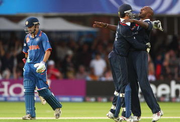 LONDON, ENGLAND - JUNE 14:  Dimitri Mascarenhas (R) of England celebrates the wicket of Gautam Gambhir of India with James Foster during the ICC World Twenty20 Super Eights match between England and India at Lord's on June 14, 2009 in London, England.  (Photo by Tom Shaw/Getty Images)