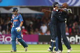 LONDON, ENGLAND - JUNE 14:  Dimitri Mascarenhas (R) of England celebrates the wicket of Gautam Gambhir of India with James Foster during the ICC World Twenty20 Super Eights match between England and India at Lord's on June 14, 2009 in London, England.  (Photo by Tom Shaw/Getty Images)