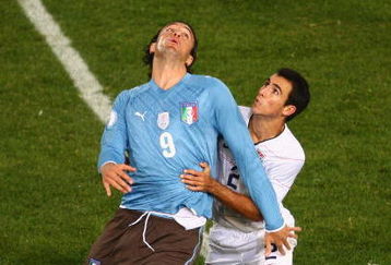 PRETORIA, SOUTH AFRICA - JUNE 15:  Luca Toni of Italy battles with Jonathan Bornstein of USA during the FIFA Confederations Cup match between USA and Italy at Loftus Versfeld Stadium on June 15, 2009 in Pretoria, South Africa.  (Photo by Jamie McDonald/Getty Images)