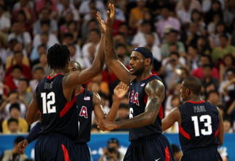BEIJING - AUGUST 24:  LeBron James #6 and Chris Bosh #12 of the United State celebrate a play in the gold medal game against Spain during Day 16 of the Beijing 2008 Olympic Games at the Beijing Olympic Basketball Gymnasium on August 24, 2008 in Beijing, China.  (Photo by Jed Jacobsohn/Getty Images)