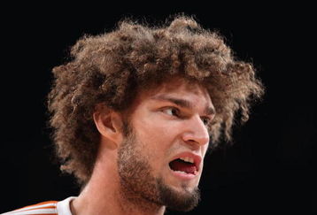 LOS ANGELES, CA - FEBRUARY 26:  Robin Lopez #15 of the Phoenix Suns warms up before the NBA game against the Los Angeles Lakers at Staples Center on February 26, 2009 in Los Angeles, California.    The Lakers defeated the Suns 132-106.  NOTE TO USER: User expressly acknowledges and agrees that, by downloading and or using this Photograph, user is consenting to the terms and conditions of the Getty Images License Agreement.  (Photo by Christian Petersen/Getty Images)
