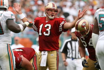 MIAMI - DECEMBER 14:  Quarterback Shaun Hill #13 of the San Francisco 49ers calls out a play at the line of scrimmage against the Miami Dolphins at Dolphin Stadium on December 14, 2008 in Miami, Florida. The Dolphins defeated the 49ers 14-9.  (Photo by Doug Benc/Getty Images)