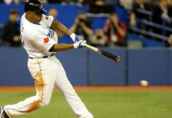TORONTO - APRIL 6:  Vernon Wells #10 of the Toronto Blue Jays hits an RBI single against the Detroit Tigers in the 8th inning during their MLB game at the Rogers Centre April 6, 2009 in Toronto, Ontario.(Photo By Dave Sandford/Getty Images)