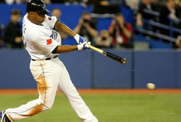 TORONTO - APRIL 6:  Vernon Wells #10 of the Toronto Blue Jays hits an RBI single against the Detroit Tigers in the 8th inning during their MLB game at the Rogers Centre April 6, 2009 in Toronto, Ontario.(Photo By Dave Sandford/Getty Images)