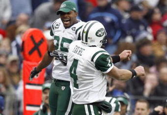 NASHVILLE, TN - NOVEMBER 23:  Quarterback Brett Favre #4 of the New York Jets celebrates with  Kerry Rhodes #25 during the game against the Tennessee Titans at LP Field on November 23, 2008 in Nashville, Tennessee. (Photo by Kevin C. Cox/Getty Images)