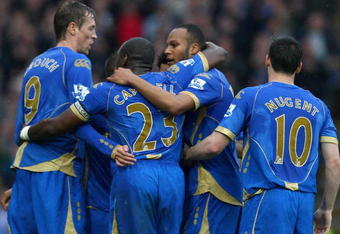 PORTSMOUTH, UNITED KINGDOM - APRIL 11:  Younes Kaboul of Portsmouth celebrates with his teammates (L-R) Peter Crouch, Sol Campbell and David Nugent after scoring the opening goal during the Barclays Premier League match between Portsmouth and West Bromwich Albion at Fratton Park on April 11, 2009 in Portsmouth, England.  (Photo by Ryan Pierse/Getty Images)