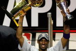 ORLANDO, FL - JUNE 14:  Kobe Bryant #24 of the Los Angeles Lakers holds up the Larry O'Brien trophy and the MVP trophy after the Lakers defeated the Orlando Magic 99-86 in Game Five of the 2009 NBA Finals on June 14, 2009 at Amway Arena in Orlando, Florida.  NOTE TO USER:  User expressly acknowledges and agrees that, by downloading and or using this photograph, User is consenting to the terms and conditions of the Getty Images License Agreement.  (Photo by Chris Graythen/Getty Images)