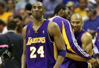 ORLANDO, FL - JUNE 14:  Kobe Bryant #24, Josh Powell #21 and Derek Fisher #2 of the Los Angeles Lakers begin celebrating in the fourth quarter before defeating the Orlando Magic 99-86 in Game Five of the 2009 NBA Finals on June 14, 2009 at Amway Arena in Orlando, Florida.  NOTE TO USER:  User expressly acknowledges and agrees that, by downloading and or using this photograph, User is consenting to the terms and conditions of the Getty Images License Agreement.  (Photo by Elsa/Getty Images)