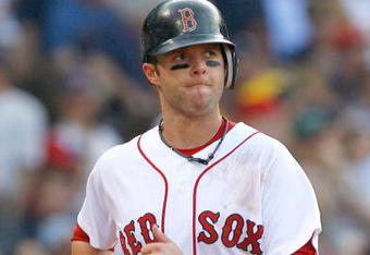 BOSTON - APRIL 25: Dustin Pedroia #15 of the Boston Red Sox reacts against the New York Yankees at Fenway Park on April 25, 2009 in Boston, Massachusetts. (Photo by Jim Rogash/Getty Images)
