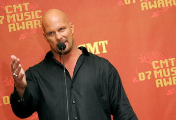 NASHVILLE, TN - APRIL 16:  Wrestler/Presenter Stone Cold Steve Austin is interviewed in the press room at the 2007 CMT Music Awards at the Curb Event Center at Belmont University April 16, 2007 in Nashville, Tennessee.  (Photo by Evan Agostini/Getty Images)