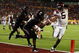 MIAMI - JANUARY 01: Tyrod Taylor #5 of the Virginia Tech Hokies runs the ball for a toucdown against Brandon Underwood #8 of the Cincinnati Bearcats during the FedEx Orange Bowl against at Dolphin Stadium on January 1, 2009 in Miami, Florida. (Photo by Doug Benc/Getty Images)