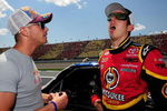 BROOKLYN, MI - JUNE 14:  Scott Speed, driver of the #22 Red Bull Toyota speaks with Kyle Busch, driver of the #51 Miccosukee Toyota speak on pit road prior to the start of the NASCAR Craftsman Truck Series Cool City Customs 200 at the Michigan International Speedway on June 14, 2008 in Brooklyn, Michigan.  (Photo by Rusty Jarrett/Getty Images for NASCAR)