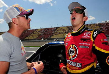 BROOKLYN, MI - JUNE 14:  Scott Speed, driver of the #22 Red Bull Toyota speaks with Kyle Busch, driver of the #51 Miccosukee Toyota speak on pit road prior to the start of the NASCAR Craftsman Truck Series Cool City Customs 200 at the Michigan International Speedway on June 14, 2008 in Brooklyn, Michigan.  (Photo by Rusty Jarrett/Getty Images for NASCAR)