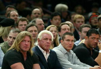 NEW YORK - MARCH 9:  WWE wrestlers (L-R) Triple H, Ric Flair, Randy Orton and Batista sit courtside at the New York Knicks v Boston Celtics  NBA game March 9, 2004 at Madison Square Garden in New York City.   (Photo by Ray Amati/Getty Images)