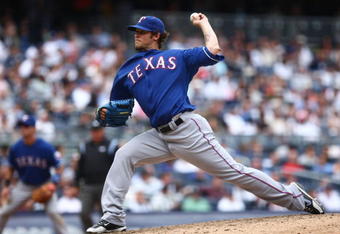 NEW YORK - JUNE 04:  C.J. Wilson #36 of the Texas Rangers pitches against the New York Yankees of the Texas Rangers during their game on June 4, 2009 at Yankee Stadium in the Bronx borough of New York City.  (Photo by Chris McGrath/Getty Images)