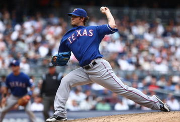 NEW YORK - JUNE 04:  C.J. Wilson #36 of the Texas Rangers pitches against the New York Yankees of the Texas Rangers during their game on June 4, 2009 at Yankee Stadium in the Bronx borough of New York City.  (Photo by Chris McGrath/Getty Images)