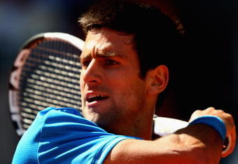 MADRID, SPAIN - MAY 16:  Novak Djokovic of Serbia plays a forehand follow through against Rafael Nadal of Spain  in their semi-final during the Madrid Open tennis tournament at the Caja Magica on May 16, 2009 in Madrid, Spain.  (Photo by Clive Brunskill/Getty Images)