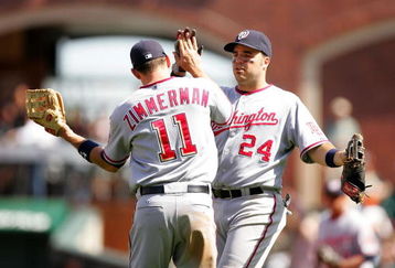 SAN FRANCISCO - MAY 13:  Ryan Zimmerman #11 and Nick Johnson #24 of the Washington Nationals celebrate after they beat the San Francisco Giants at AT&T Park on May 13, 2009 in San Francisco, California. (Photo by Ezra Shaw/Getty Images)
