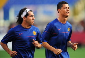 ROME - MAY 26:  Carlos Tevez and Cristiano Ronaldo of Manchester United run as they attend the Manchester United training session prior to UEFA Champions League Final versus Barcelona at the Stadio Olimpico on May 26, 2009 in Rome, Italy.  (Photo by Shaun Botterill/Getty Images)