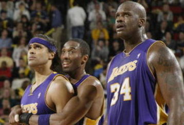 SEATTLE - APRIL 2:  Rick Fox #17 of the Los Angeles Lakers is restrained by teammate Kobe Bryant #8 after being called for a technical foul against the Seattle SuperSonics on April 2 2004 at Key Arena in Seattle, Washington. Gary Payton #20 is at left and Shaquille O'Neal #34 is at right. NOTE TO USER: User expressly acknowledges and agrees that, by downloading and/or using this photograph, User is consenting to the terms and conditions of the Getty Images License Agreement. (Photo by Otto Greule Jr/Getty Images)
