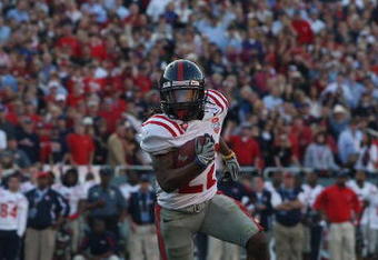 DALLAS - JANUARY 02:  Wide receiver Dexter McCluster #22 of the Mississippi Rebels runs the ball against the Texas Tech Red Raiders during the AT&T Cotton Bowl on January 2, 2009 at the Cotton Bowl in Dallas, Texas.  (Photo by Ronald Martinez/Getty Images)